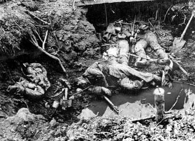 dead Germans soldiers in front of a dugout at La Basse