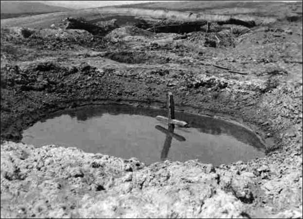 Cross in a flooded shell hole