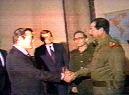 Donald Rumsfeld shaking hands with Saddam Hussein